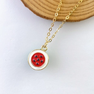 Detailed view of a creative watermelon pendant necklace with vibrant enamel fruit charm