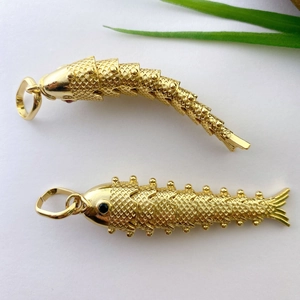 Articulated gold plated koi fish pendant with intricate scales and vibrant bead eyes