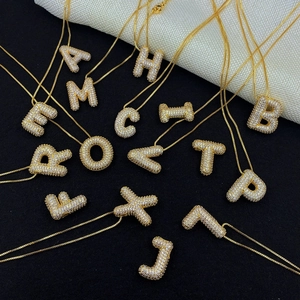 Golden 3D bubble initial necklaces with sparkling cubic zirconia on a luxury dual-tone base
