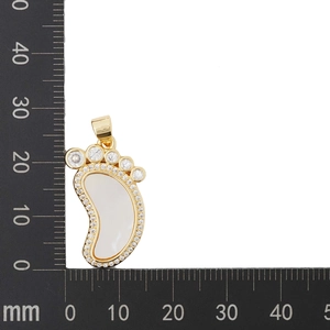 Golden feet pendant with shell inlay and zircons shown against a 25mm measurement scale