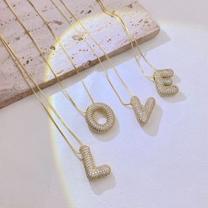 Sparkling gold-plated LOVE alphabet pendant necklace set with micro-paved cubic zirconia