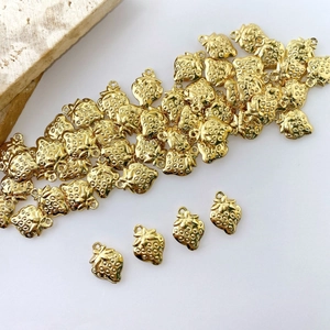 Polished gold strawberry charms for DIY jewelry making with realistic seed textures
