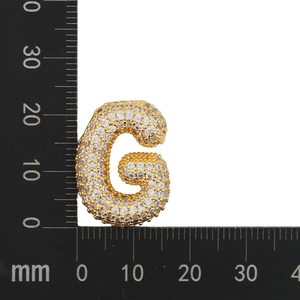 Detailed size measurement of a gold zircon letter G pendant showing height of 25mm