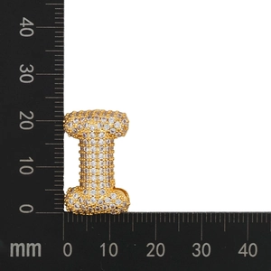 Close-up of gold-plated cubic zirconia letter I pendant with measurement scale
