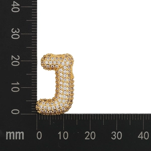 Detail showing dimension of crystal zircon letter J pendant measuring 25mm by 18mm