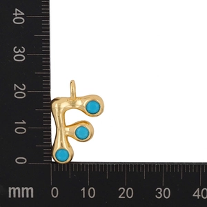 Size measurement of golden letter F pendant with blue zircon stones showing 18mm height