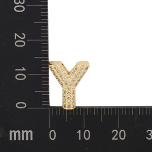 Macro shot of gold letter Y pendant with white zircon stones measuring 14mm in height