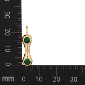 Macro shot of gold-plated teardrop letter pendant with green zircon and 18mm size scale