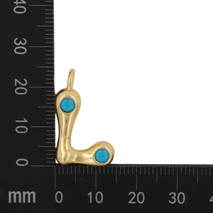 Macro scale measurement of letter L gold pendant with turquoise stones showing size details