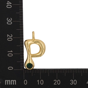Macro detail of gold letter P pendant with green zircon showing 20mm height on a scale
