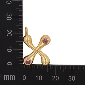 Detailed size view of gold-plated X-shaped pendant with pink cubic zirconia stones