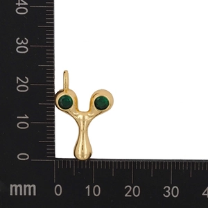Detail view of gold DIY letter Y pendant with green zircon stones and millimeter ruler scale