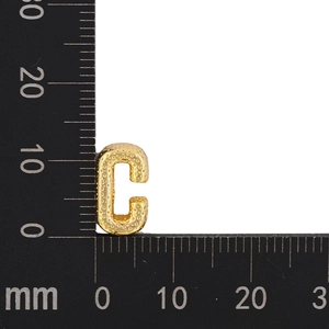 Detail showing gold letter C pendant measured with a scale at 15mm by 11mm height
