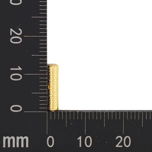 Detailed view of 11mm gold letter bead showing hammered texture and dimensions