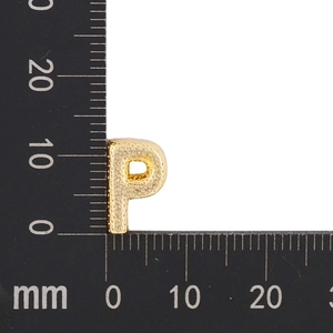 Macro shot of gold-plated letter P pendant with granular texture showing 10x8mm size