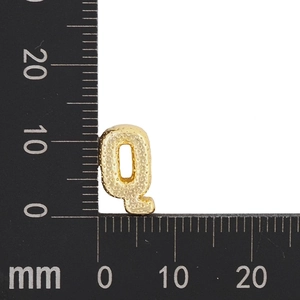 Detail view of gold letter Q pendant measuring 11x8mm with textured bead finish