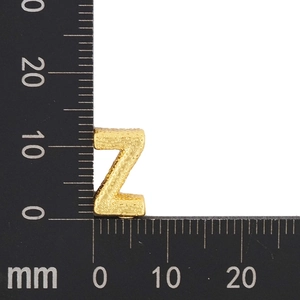 Detail view of gold plated letter Z pendant showing size measurements and hammer texture