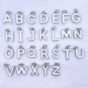 Set of 26 white enamel alphabet charms with silver borders for DIY jewelry making