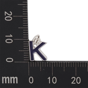 Detail showing an 11mm silver K-letter pendant with deep purple enamel finish and scale