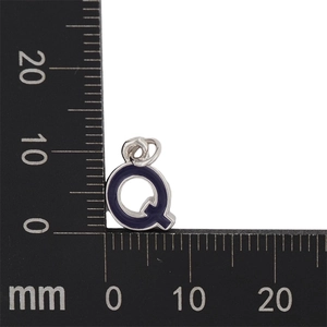Macro shot of purple enamel letter Q pendant with dimensions 10x10mm for DIY jewelry