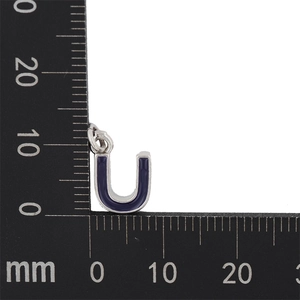 Macro detail of silver letter U pendant with blue enamel and measurement scale