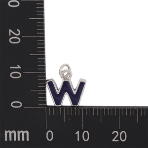 Macro view of purple enamel letter W charm with silver metal border and measurement ruler