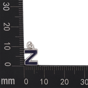 Macro view of blue enamel letter Z pendant with silver base measuring 10mm in size