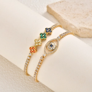 Bracelet œil porte-bonheur et trèfles colorés plaqué or avec zircons brillants de luxe
