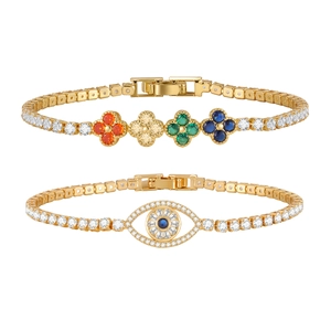 Bracelets de tennis dorés avec trèfles à quatre feuilles colorés et design œil protecteur