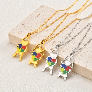 Collier cœur puzzle en acier inoxydable avec silhouettes de garçon et fille, or et argent