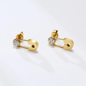Detailed macro of 316L stainless steel gold safety pin earrings with cubic zirconia