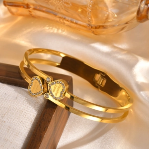 Golden stainless steel double-row bangle featuring crystal heart and Forever Love engraving