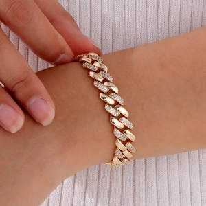 Detailed view of luxury gold-plated copper Cuban link bracelet with micro pave zircons