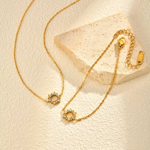 18K gold sunflower necklace and bracelet set with sparkling zircon pavé accents