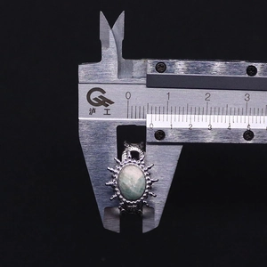 Detail view of vintage sunburst ring with green tiger eye stone measured at 13mm
