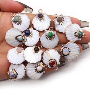 Scallop shell pendants with colorful inset gemstones and gold-plated metal accents