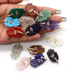 Hamsa Hand natural stone pendant with evil eye center and gold-plated bail