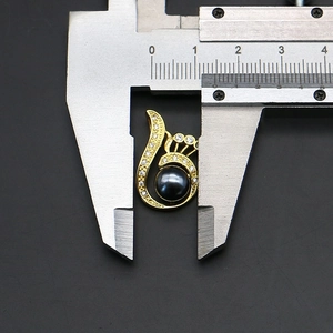 Detail showing a 12mm measurement of the luxury gold pearl pendant with zircon stones
