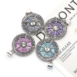 Set of four Tai Chi Yin Yang shell pendants with round vintage silver plated alloy frames