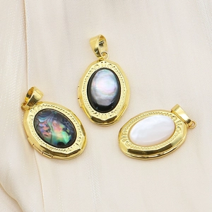 French style oval locket pendants with natural shell inlay in polished gold plating