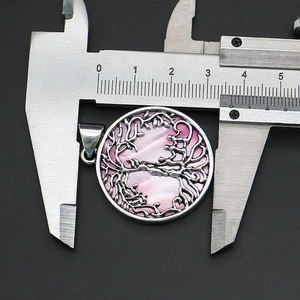Macro shot of 34mm Tree of Life pendant in pink mother of pearl with caliper measurement