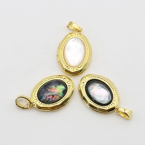 Three gold oval shell lockets with mother of pearl and abalone shell inlays
