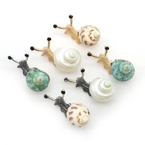 Set of 6 gold seashell snail brooches with natural shell textures and crystal accents