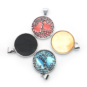 Tree of Life shell pendants in red, blue, black, and yellow with metal frames