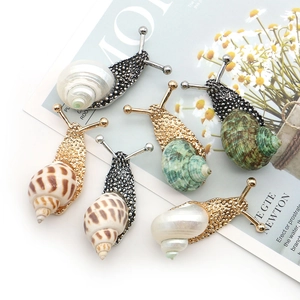 Exquisite snail-shaped brooches with natural shell inlays in gold and silver finishes
