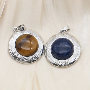Locket necklace with natural tiger eye and lapis lazuli stone on elegant satin background