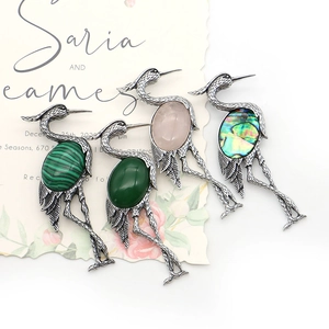 Natural stone crane brooches in pink quartz and malachite with vintage silver finish
