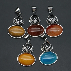 Detail of five gourd-shaped alloy pendants with various semi-precious gemstones