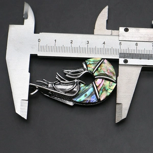 Shrimp shaped zinc alloy brooch and pendant measuring 50mm with a digital caliper