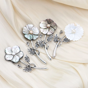 Natural black shell flower brooches with pearl center and vintage silver flower stems